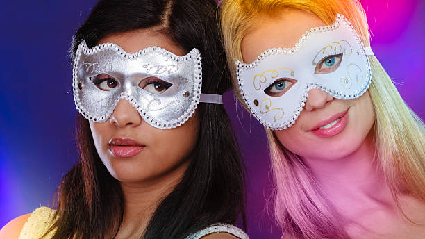 istock Two women face with carnival venetian masks 501857518