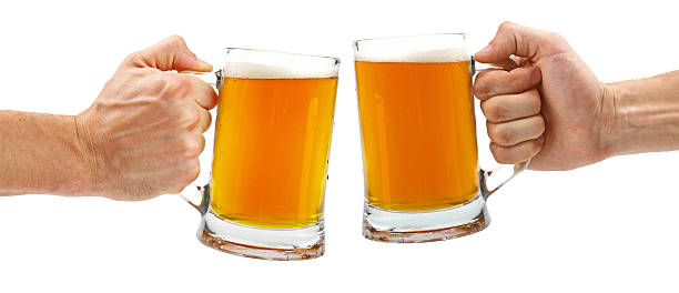 istock cheers, two glass beer mugs isolated on white 501859041