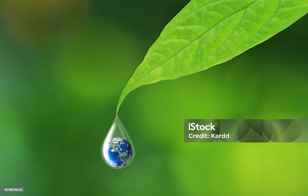 Safe earth safe water Earth in water drop reflection under green leaf Water Stock Photo