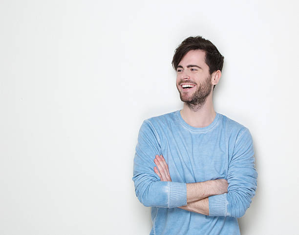 istock Attractive man smiling with arms crossed 501859671