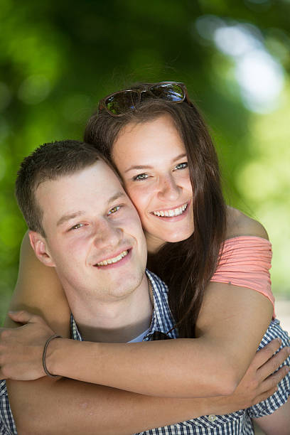 istock Couple with female riding piggyback 501859895