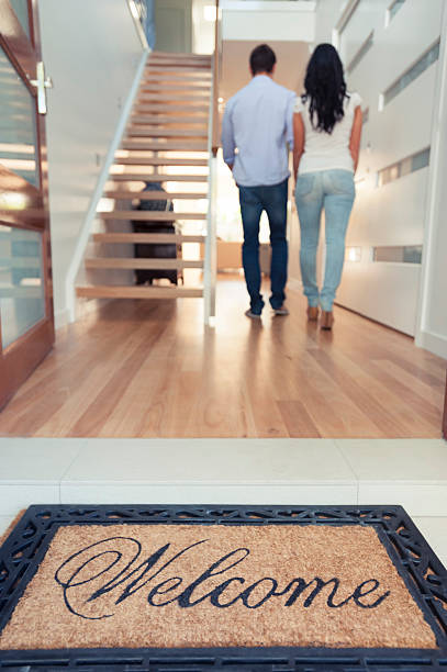 istock Happy young couple walking into their new house 501861829