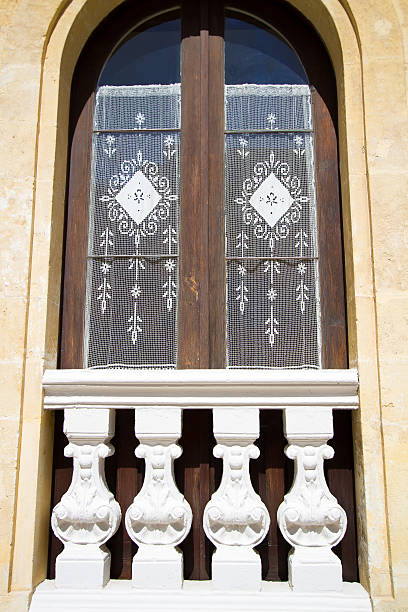 istock Tall French Windows with White Handmade Lace Curtains, Sicily 501863745