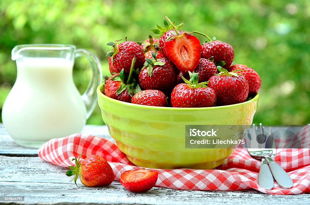 Strawberry in green bowl. Strawberry in green bowl on the natural background. Berry Fruit Stock Photo