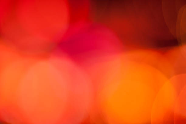 Abstract defocused orange and red circular light pattern stock photo