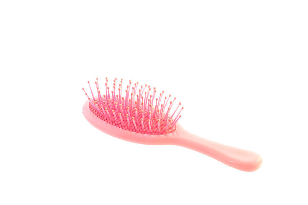 istock Pink comb for hair on white background 501881084