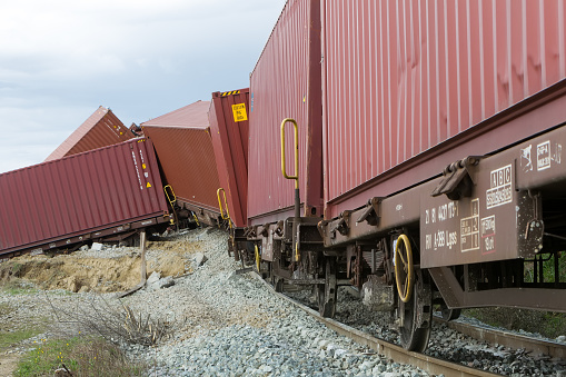 Thessaloniki, Greece - March 28, 2015: Derailed train coaches at the site of a train accident at the Gefyra community, in northern Greece. The train was carrying electronic equipment .