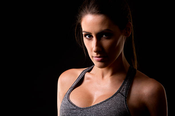 istock fitness woman on black background 501884984