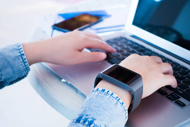 istock Woman working on laptop wearing a smartwatch 501887588