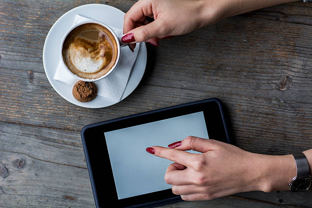 istock Woman' s hand touch tablet 501889564