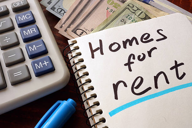 istock Notebook with homes for rent  sign on a table. 501891266