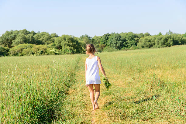 istock the girl with wild flowers 501903856
