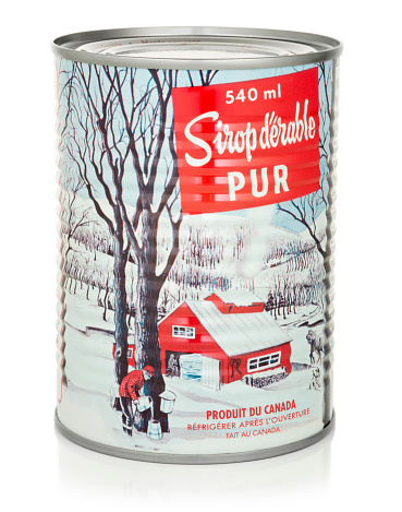 Montreal, QC, Canada – November 10, 2014: A can of pure maple syrup from Decacer – Maple syrup, maple flakes an maple sugar in bulk.
