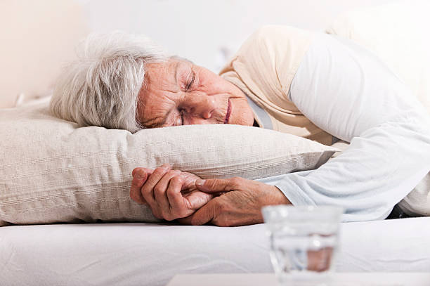 Elderly woman  in bed Elderly woman with drugs in bed hospital depression sadness bed stock pictures, royalty-free photos & images