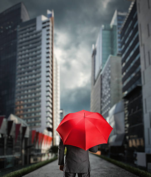 istock Businessman with an umbrella 501909648