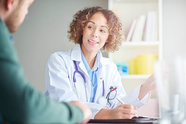 istock female doctor and patient discussing notes 501912280
