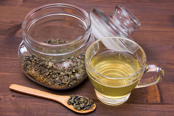 istock Cup of green tea on wood 501913348