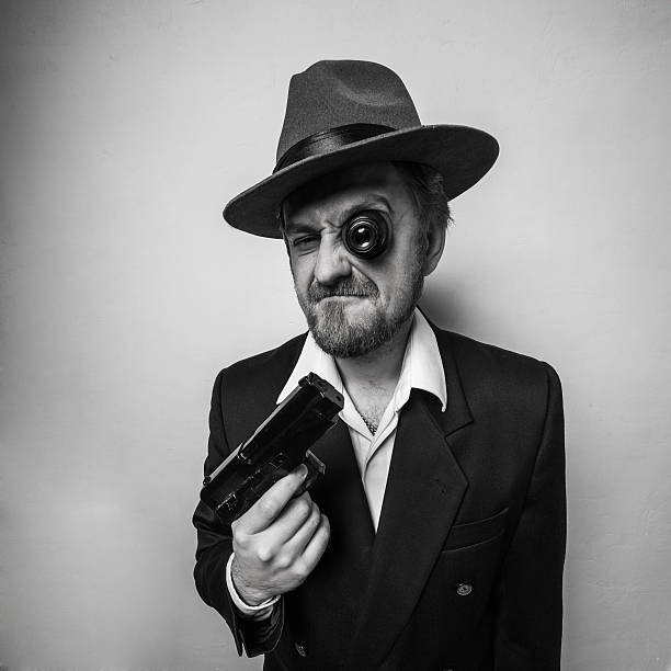 istock crazy beard detective whit gun in hat 501914008