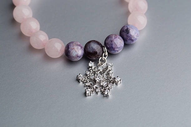 istock Silver snowflake on amethyst bracelet 501915658