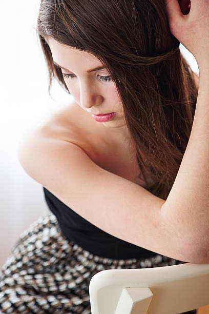 istock Beautiful girl sitting on chair 501916176