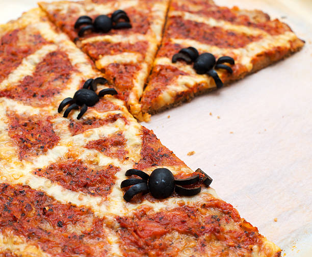 istock Ideas for Halloween. Pizza with olives spiders. 501917566