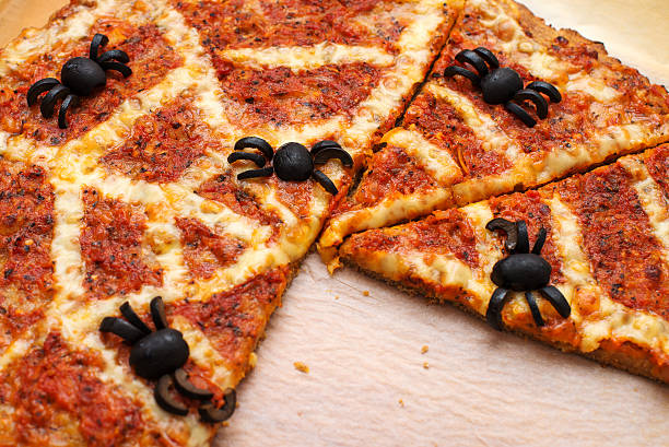 Ideas for Halloween. Pizza with olives spiders. stock photo