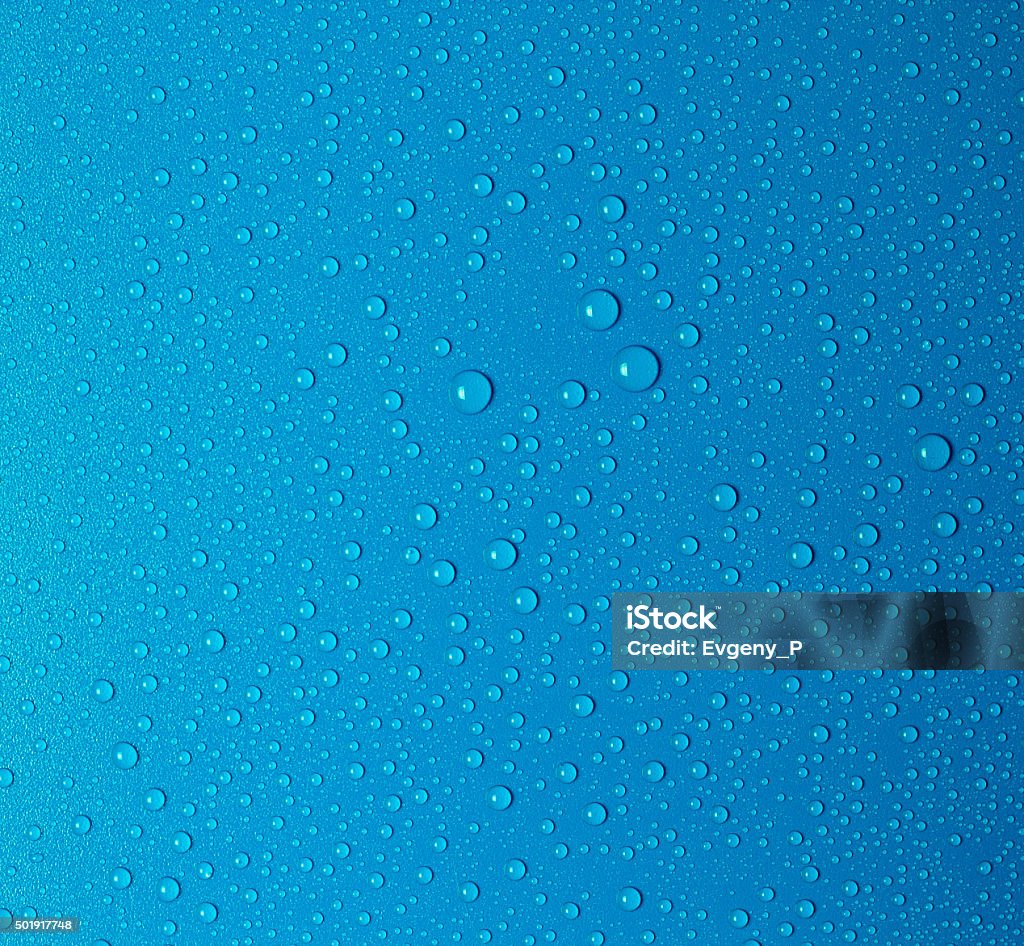 Water drops Water drops on a blue surface Backgrounds Stock Photo
