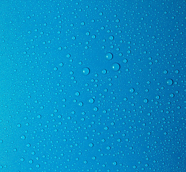 Water drops Water drops on a blue surface blue condensation stock pictures, royalty-free photos & images