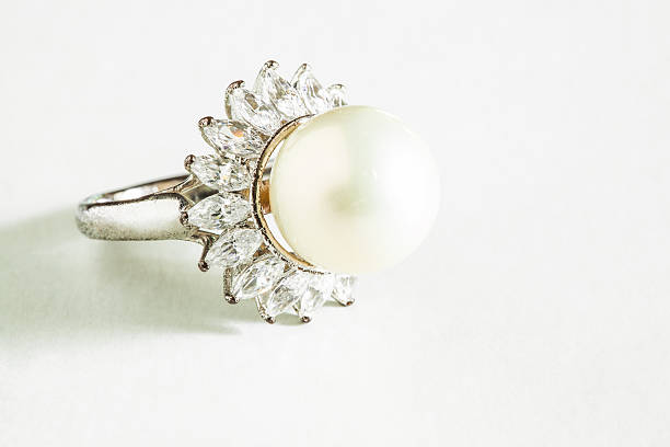istock Beautiful pearl ring isolated on white 501918188