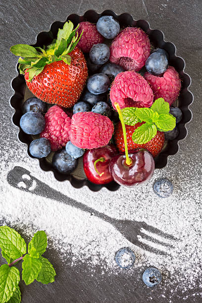 istock Fresh berries in a small round metal backing mould 501918540