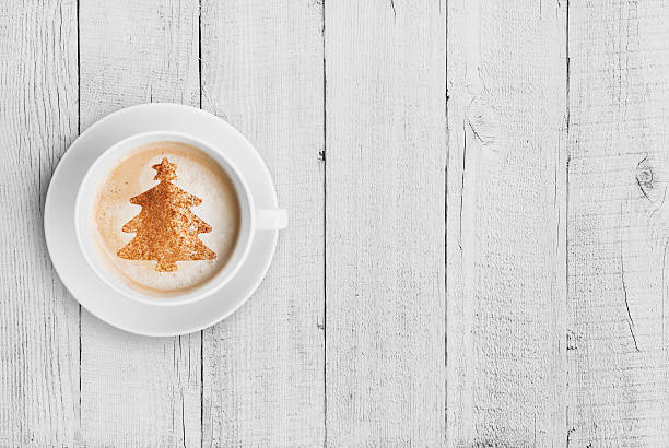 istock coffee mug with christmas tree shape on white wood table 501919158