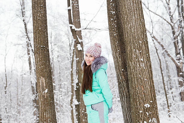 istock Beautiful young girl walking in winter forest 501931146