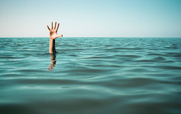 istock Hand in sea water asking for help. Failure and rescue 501931290