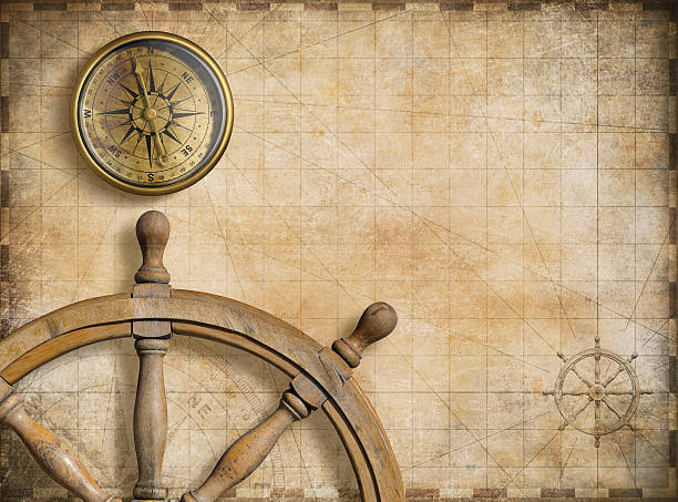 istock vintage golden compass with nautical map background 501931604