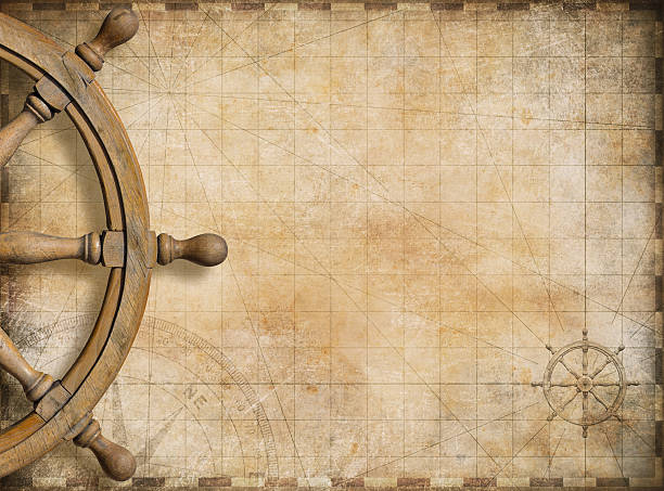 istock steering wheel and blank vintage nautical map background 501931622