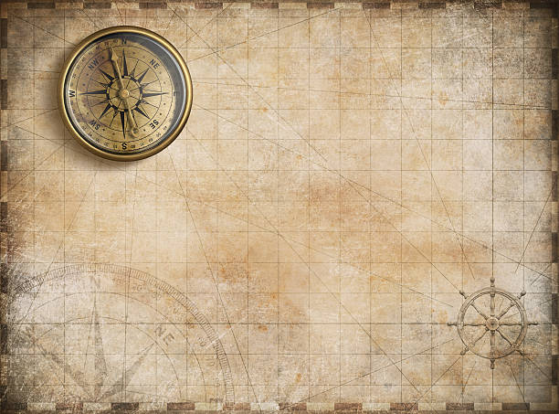 istock vintage golden compass with nautical map background 501931728