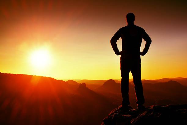 istock Silhouette of Young Confident and Powerful Man Standing withSpace 501932156