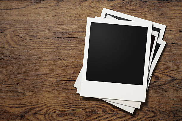 istock polaroid photo frames on old wooden table 501933352