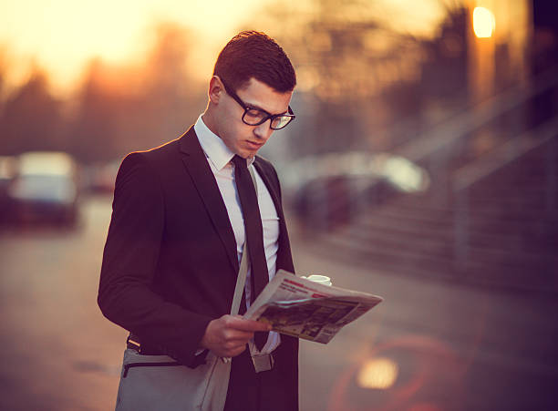 istock Business Man With Coffee and Newspaper 501933416