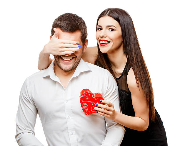 istock Young beautiful couple with present isolated on white 501936204
