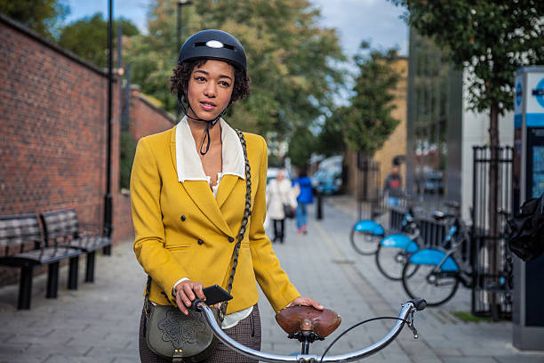 istock Woman walking with bicycle in Central London 501938070