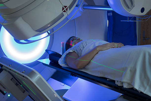 Asian Woman receiving Radiation Therapy Treatments for Cancer stock photo