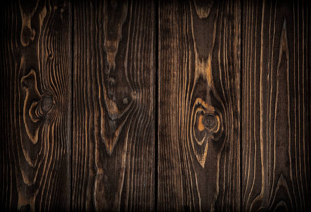 istock dark wood planks background 501940114