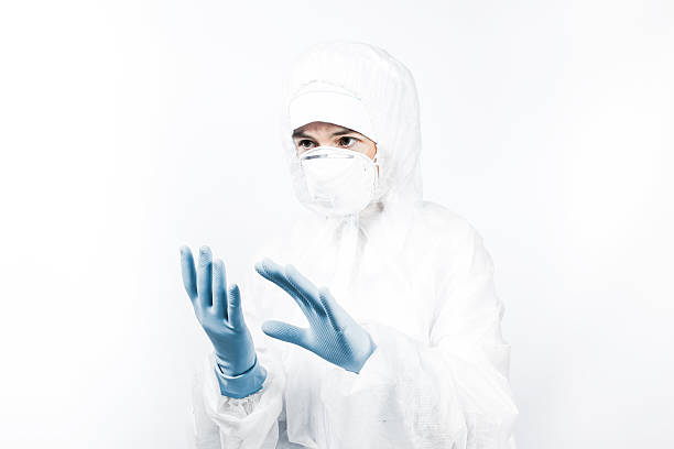 istock Person in biohazard suit working at laboratory 501940514