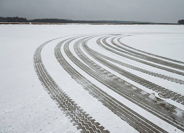 istock Auto tyre tracks in the snow 501940778