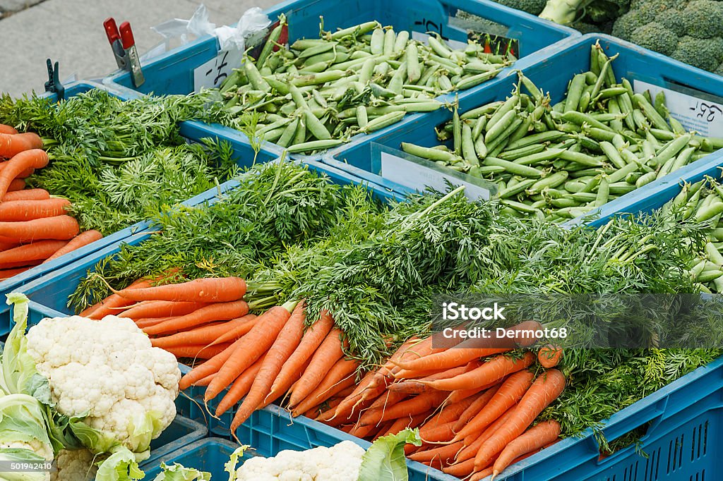 Detail of various vegetable items on farmer market Photo shows detail view of various vegetable items on farmer market in plastic boxes during a day. Farmer Stock Photo