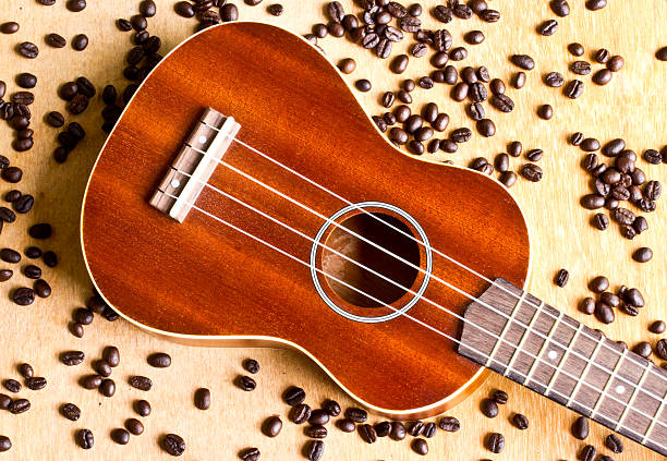 istock Coffee beans and Ukulele on wood background 501944229