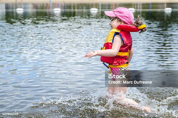 Running In Water Stock Photo - Download Image Now - 4-5 Years, Baseball Cap, Beach