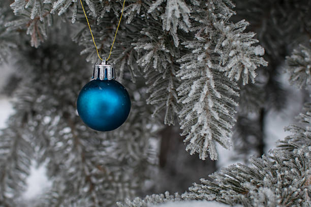 istock Christmas-tree toy on a snowy branch 501944374
