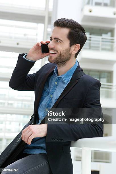 Cute Guy On Mobile Phone Indoors Stock Photo - Download Image Now - 20-29 Years, Adult, Adults Only